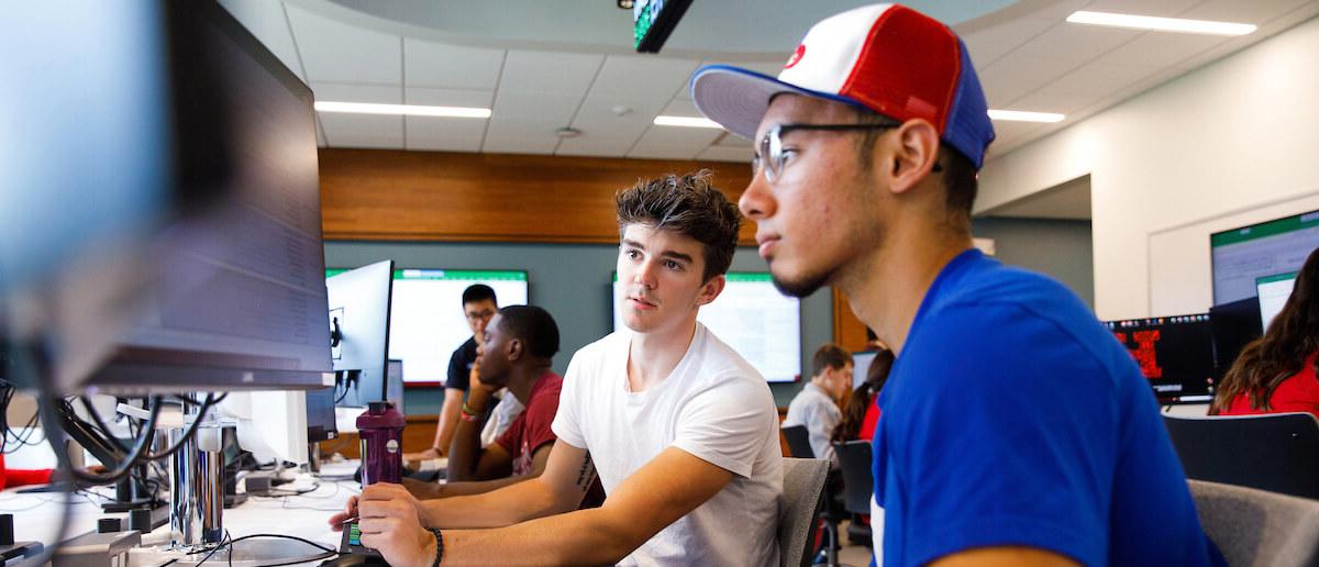 Barney students having a discussion at the trading lab